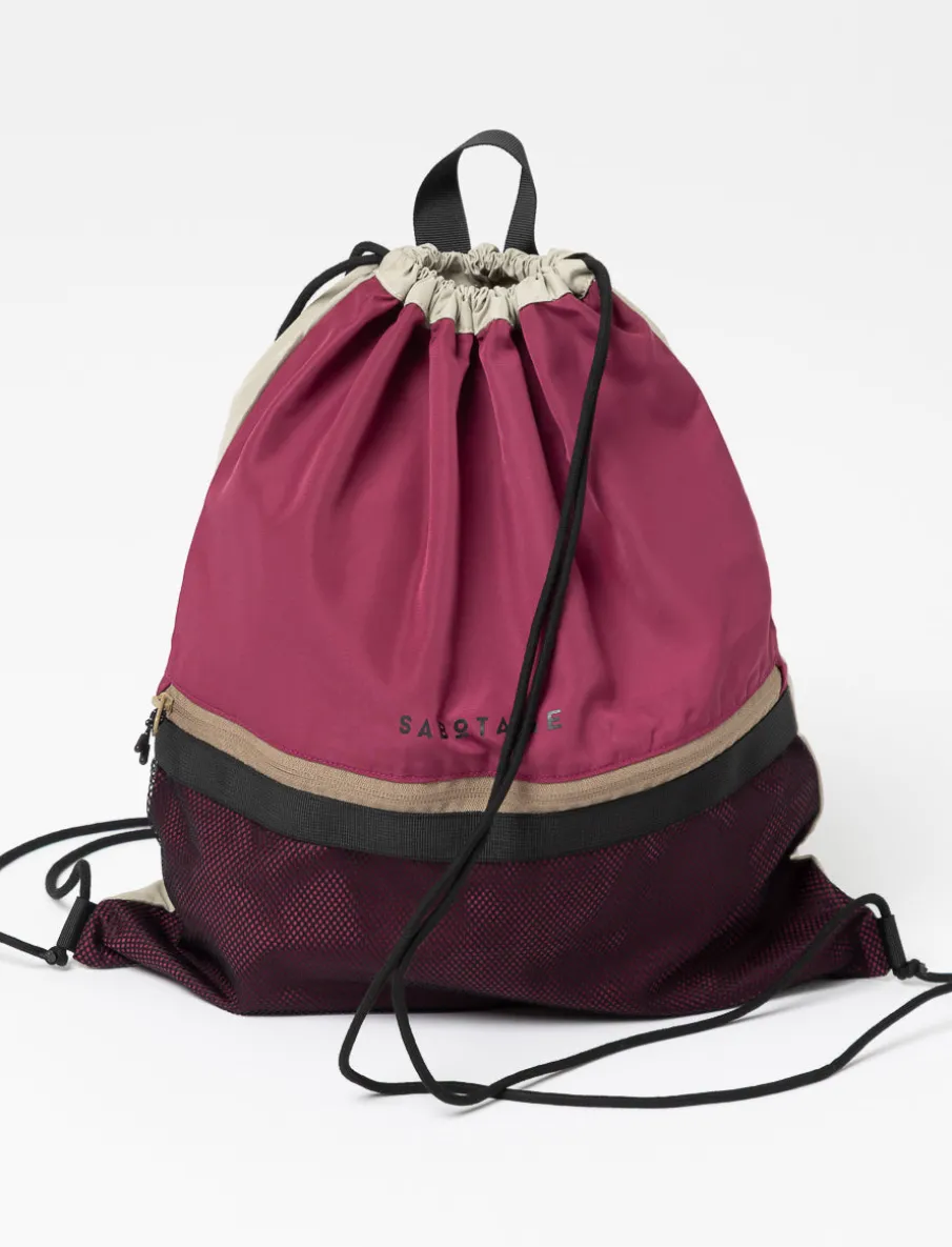 Pink drawstring bag with mesh pocket